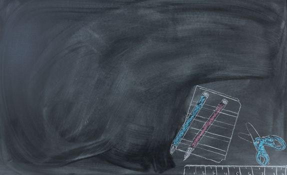 Back to School concept with erased chalk board and hand drawn supplies 