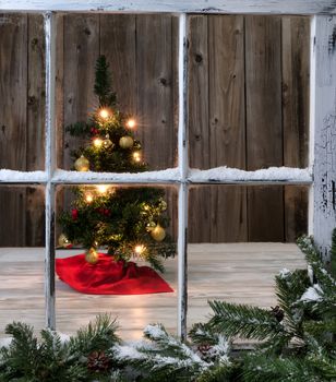 Christmas Tree decoration on wooden background with outdoor window in forefront