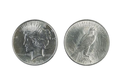 Closeup photo of a Two Peace Silver Dollars, obverse and reverse sides, isolated on white  