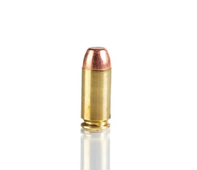 Single bullet isolated on white background with reflection 