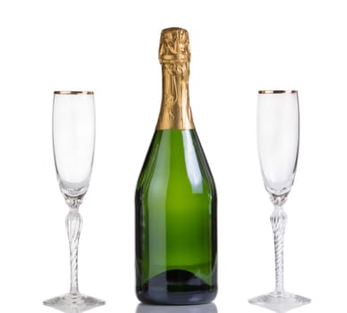 Champagne bottle with drinking glasses isolated on white with reflection