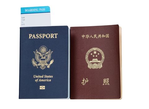 United States and China passport and boarding pass isolated on white background. 