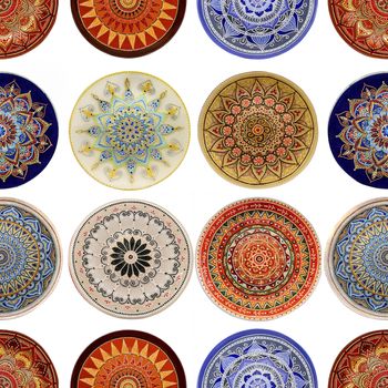 Seamless background from a set of decorative ceramic dishes hand-painted with acrylic paints with a floral pattern.