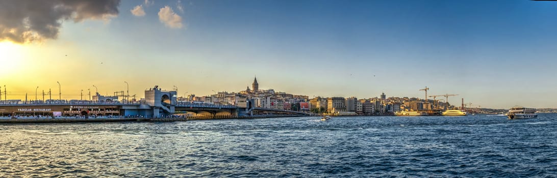 Istambul, Turkey – 07.12.2019. Panoramic view of Eminonu Square, Galata Bridge, Galata Tower and New Mosque in istanbul on a sunny summer evening