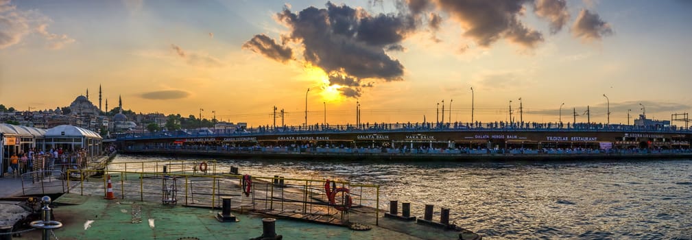 Istambul, Turkey – 07.12.2019. Panoramic view of Eminonu Square, Galata Bridge, Galata Tower and New Mosque in istanbul on a sunny summer evening