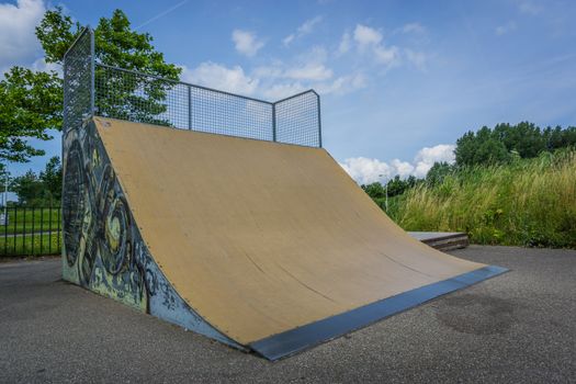 awesome extreme skate half pipe with graffiti