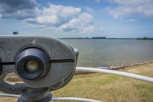 watch tower with binoculars at a beach lake blurry landscape view