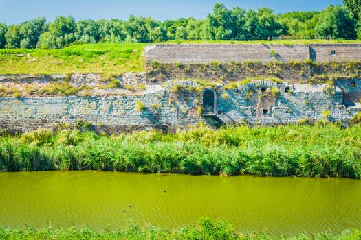 huge stone wall at the river