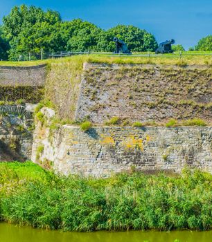 massive old stone defense wall with cannons