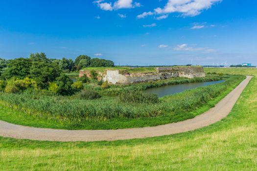 road with water landscape and big wall