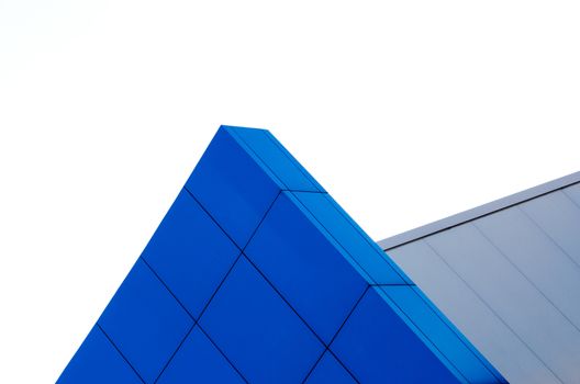 architectural abstract pattern fragment of a wall of blue modern building on a white background