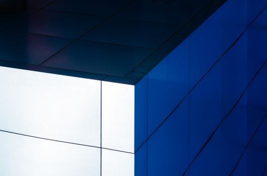 architectural abstract pattern fragment of a wall of blue modern building on a white background