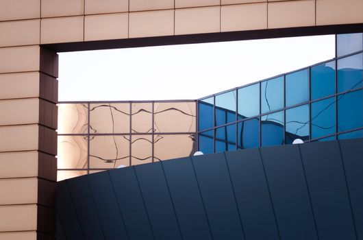 architectural abstract pattern fragment of a wall of blue modern building on a white background