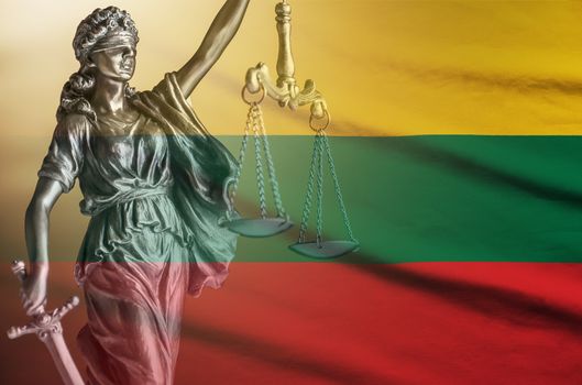 Statue of Justice with scales and sword on the Lithuanian flag with copy space conceptual of law and order
