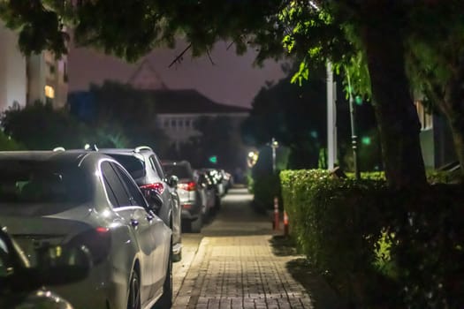 a nice looking narrow night shoot from sidewalk - there is many cars and street lights. photo has taken at izmir/turkey.