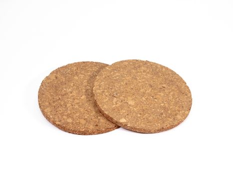 The close up of wooden cork coasters on white background.