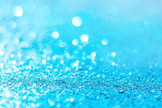 Defocused blue glitter background. blue abstract bokeh background. Christmas abstract background
