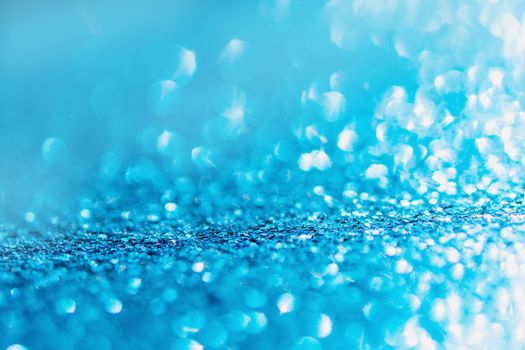 Defocused blue glitter background. blue abstract bokeh background. Christmas abstract background
