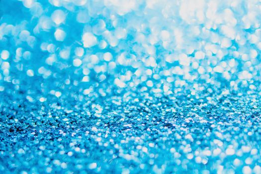 Defocused blue glitter background. blue abstract bokeh background. Christmas abstract background
