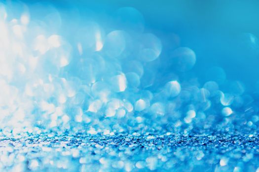 Defocused blue glitter background. blue abstract bokeh background. Christmas abstract background
