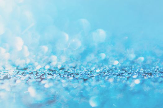 Defocused blue glitter background. blue abstract bokeh background. Christmas abstract background
