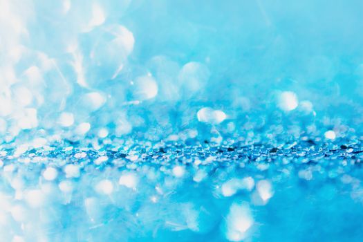 Defocused blue glitter background. blue abstract bokeh background. Christmas abstract background

