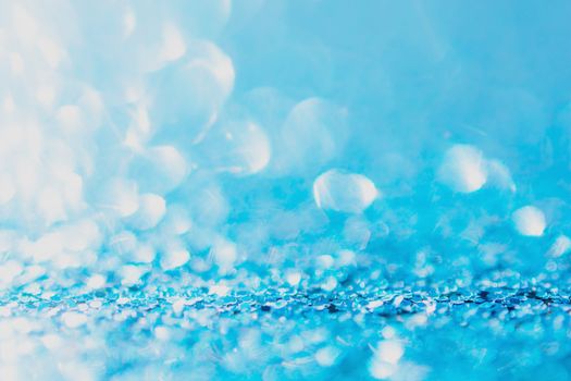 Defocused blue glitter background. blue abstract bokeh background. Christmas abstract background
