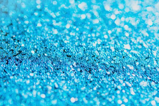 Defocused blue glitter background. blue abstract bokeh background. Christmas abstract background
