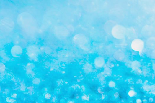 Defocused blue glitter background. blue abstract bokeh background. Christmas abstract background
