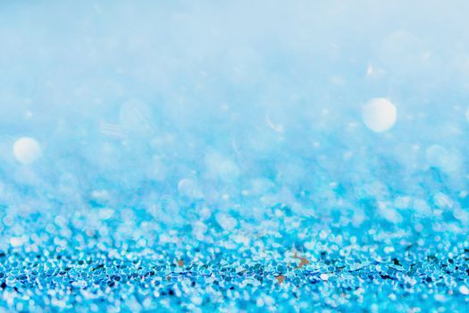 Defocused blue glitter background. blue abstract bokeh background. Christmas abstract background
