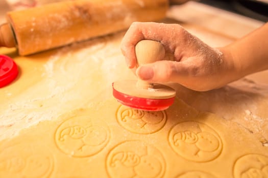 Christmas cookies bakery with raw biscuit dough and cutters with christmas theme shape