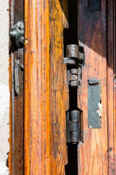 Old wood texture with the woodworm holes and hinge the door