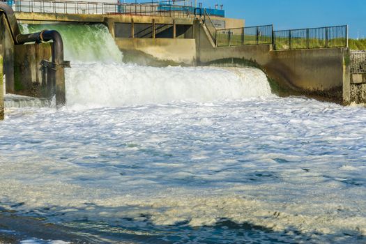 amazing beautiful and powerful waterfall at industry landscape and beach