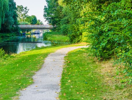 curvy road with water pond and bridge view