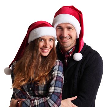 Happy beautiful couple in Santa hats, winter holidays Christmas New Year concept, isolated on white background