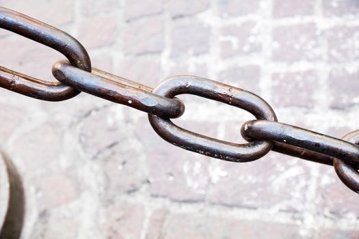 Metal chain as the fence on street