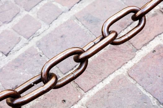 Metal chain as the fence on street