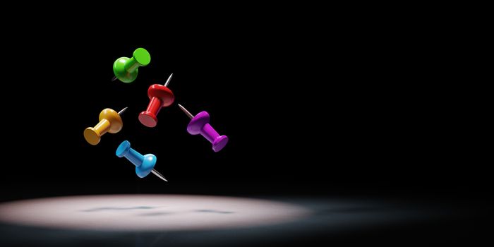 Colorful Thumbtack Spotlighted on Black Background with Copy Space 3D Illustration