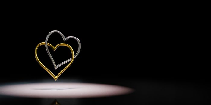 Couple of Chained Heart Shaped Golden and Silver Rings Spotlighted on Black Background with Copy Space 3D Illustration