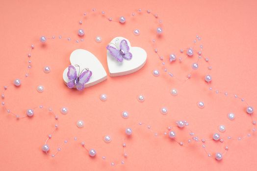 Pink hearts hanging on clothespins on a pink background.Valentine's Day . Blank for the designer. Valentines day concept. Greeting card. Copy spice.