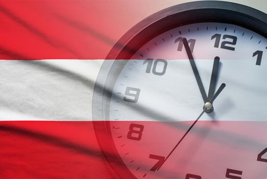 Austria flag with dial of a clock counting down to twelve noon or midnight in a concept of crisis, deadlines or new year,