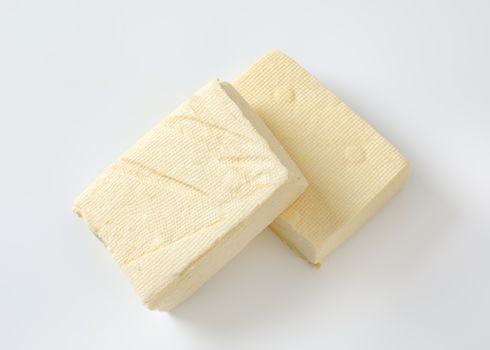 Two blocks of fresh bean curd (tofu)