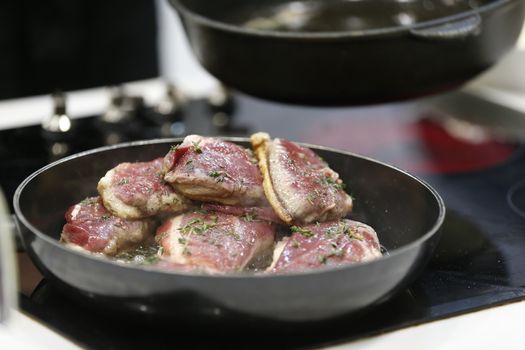 Fry meat in a frying pan.Fry the duck. Preparation of meat dishes.