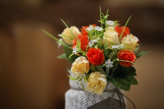 Bouquet of artificial flowers roses and forget-me-nots.Artificial flowers