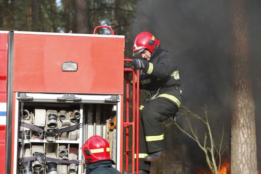 Fire, firefighter preparing to extinguish a fire.Extinguish the fire.Fighting fire. Forest fires