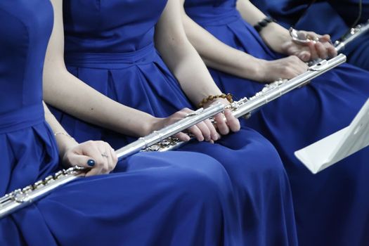 Instrument flute. Play flute. Orchestra