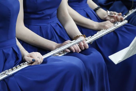 Instrument flute. Play flute. Orchestra