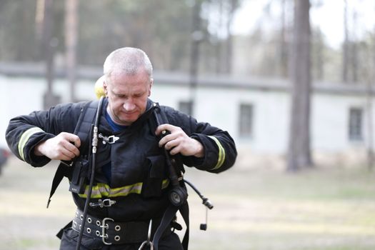 Fire man.Work firefighter. Extinguish the fire. Rescue work. Exercises of rescuers