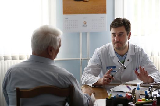 Doctor neurologist takes the patient.Reception at the doctor of elderly people.In the doctor's office