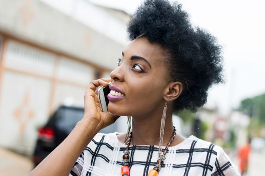 Young businesswoman smiling on the phone.